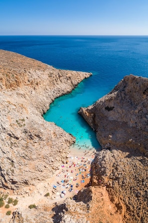 A rocky coastline with a beach area.