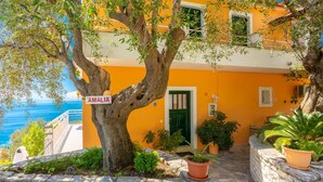 A building with a sign reading "AMALIA" and a view of the sea. - Villa Amalia Large Private Pool Walk to Beach Sea Views A C Wifi - 2120 (Corfu)
