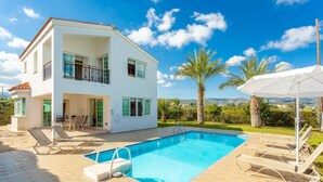A two-story house with a swimming pool, outdoor furniture, and a view of the landscape. - Villa Iliada Large Private Pool Walk to Beach A C Wifi Car Not Required - 2143 (Polis)