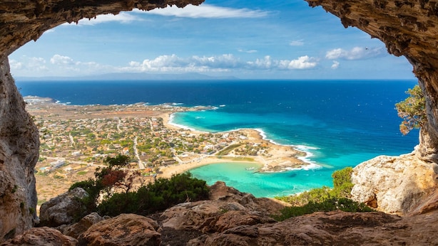 A coastal town viewed through a cave opening, with clear blue sea and a visible beach. - Villa Selini Private Pool Sea Views A C Wifi Eco-friendly - 2158 (Rethymno)
