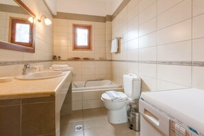 A modern bathroom with a sink, bathtub, toilet, and a mirror. - Villa Lina Large Private Pool Walk to Beach Sea Views A C Wifi Eco-friendly - 2171 (Corfu)