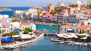A coastal town with buildings along the waterfront, a marina with boats, and a bridge connecting the areas. - Villa Asimenia Large Private Pool Sea Views A C Wifi Eco-friendly - 2388 (Rethymno)