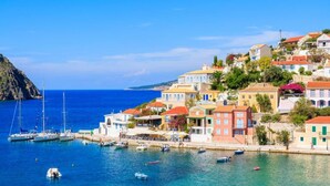 A coastal town with colorful buildings, a marina with boats, and a clear blue sea. - Villa Erasmia Large Private Pool Walk to Beach Sea Views A C Wifi - 2646 (Kefalonia)
