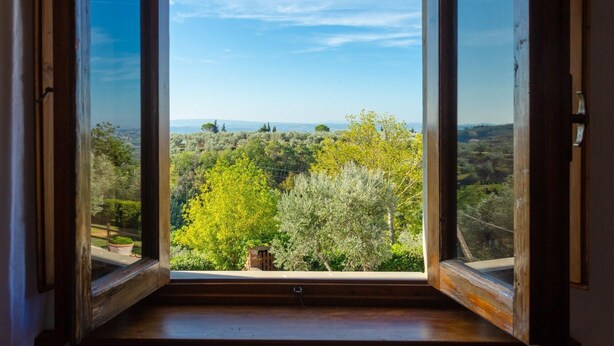 An open window with a view of a green landscape and distant hills. - Villa Le Balze Large Private Pool Wifi - 3016 (Vinci)