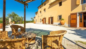An outdoor seating area with wicker furniture and a pergola. - Villa Le Balze Large Private Pool Wifi - 3016 (Vinci)