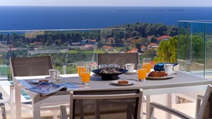 A table with breakfast items and a view of the sea. - Villa Lassi Illios Large Private Pool Walk to Beach Sea Views A C Wifi - 3055 (Kefalonia)