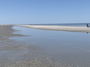 On the beach, sun loungers, beach towels