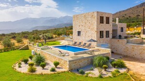 A stone villa with a swimming pool, surrounded by a well-maintained garden and a mountainous backdrop. - Villa Lulla Large Heated Private Pool Sea Views A C Wifi - 3200 (Chania)