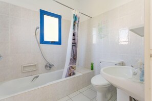 A bathroom with a bathtub, toilet, and sink. - Villa Charoula Tria Large Private Pool A C Wifi - 3273 (Polis)