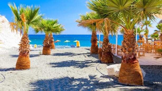 A beach with palm trees, a wooden deck, and beach umbrellas. - Villa Minoas Large Private Pool Walk to Beach Sea Views A C Wifi Eco-friendly - 2565 (Argaka)