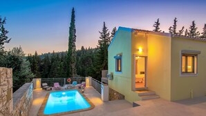 A modern villa with a swimming pool, outdoor seating, and a staircase leading to the entrance. - Villa Ifigeneia Swimming Pool Walk to Beach Sea Views A C Wifi - 3455 (Paxos)
