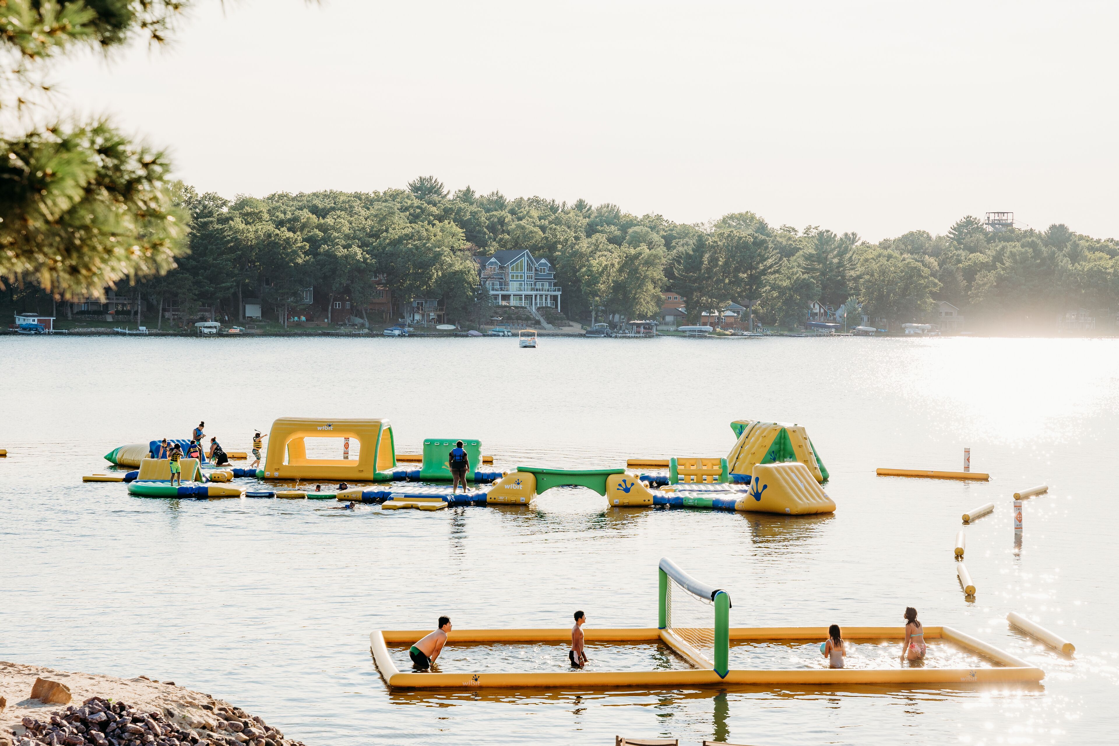 A water park with inflatable play structures and a pool.
