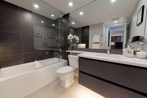 Bathtub, hair dryer, towels