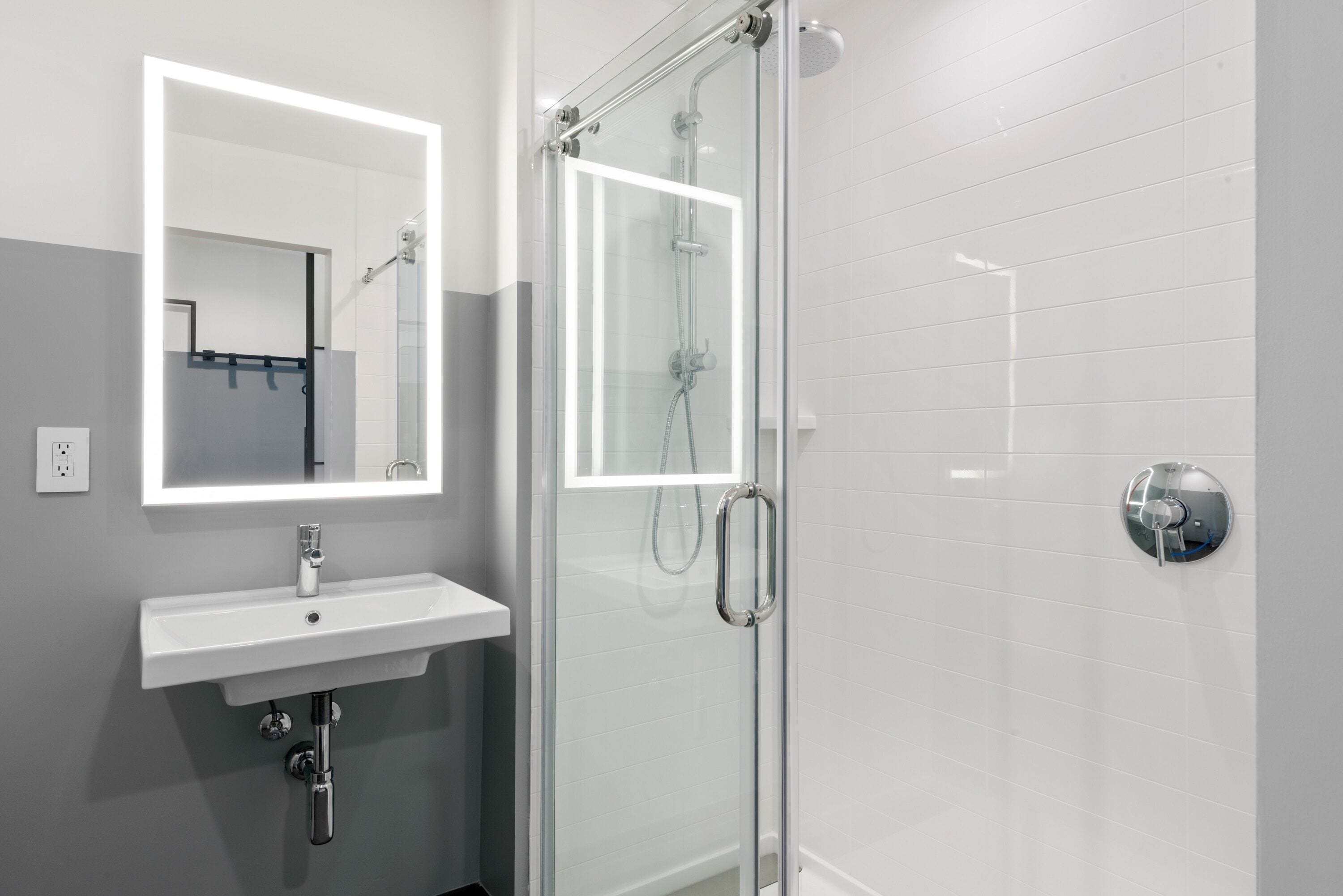 shower, rainfall showerhead, hair dryer, towels