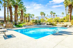 A swimming pool with palm trees and mountains in the background. - Los Pueblos #40 Pixie Dust 2 Bed, 2 Bath (Palm Springs)