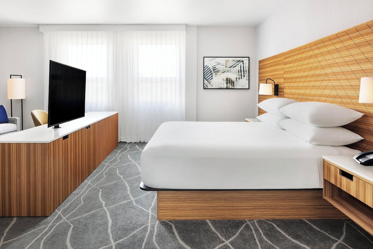 deluxe room, 1 king bed with sofa bed | 1 bedroom, desk, laptop workspace, iron/ironing board