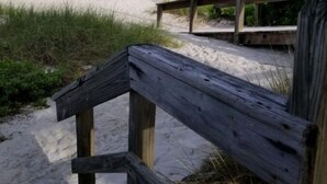 A wooden boardwalk leading to a sandy beach with a clear view of the ocean. - Main-Stay is a larger 2/1 central to all Naples (Naples)