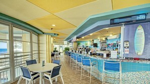 A restaurant with a bar area, outdoor seating, and a view of the ocean. - Amazing Ocean View Condo Club Wyndham Ocean Blvd in N. Myrtle Beach -1 BR/1 Bath (North Myrtle Beach)