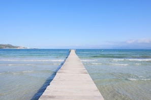 A pier extending into calm waters with a clear sky. - "Villa Jerónimo" with Mountain Views, Wi-Fi, Pool, Garden, Terrace & Balcony (Muro)