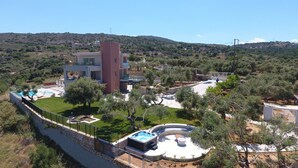 A modern villa with a swimming pool, hot tub, and a landscaped garden. - Luxury Villa Oasis, 11 bedrooms, Private Heated Pool & Jacuzzi (Rethymno)