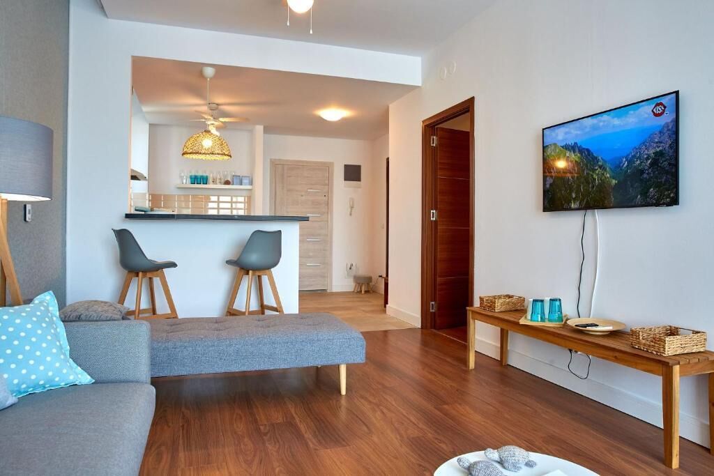 Executive Apartment | Living area | 110-inch flat-screen TV with digital channels