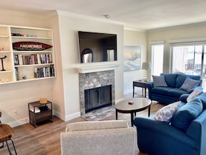 Smart TV, fireplace, books