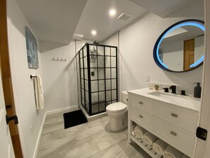 Shower, hair dryer, towels, soap