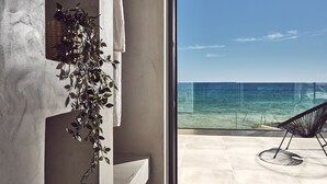 A modern bathroom with a large window overlooking a beach. - Sea Front LaMer Villa,Luxury Retreat & Heated Pool (Zakynthos)