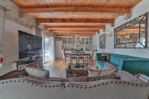 Luxury Villa | Living room | LCD TV, fireplace