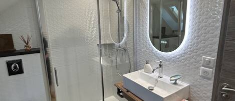 Shower, hair dryer, towels, soap