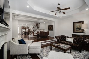 TV, fireplace, books, printers