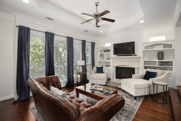 TV, fireplace, books, printers