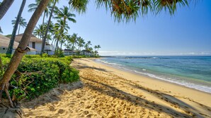 A sandy beach with palm trees and a clear blue sky. - Poipu Condo!  Newly updated - Sleeps 5 - 5 minute walk to the beach! (Koloa)