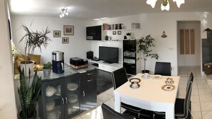 A modern kitchen with a central island, built-in appliances, and ample storage.