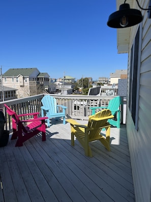 Relax in a casual outdoor seating area with Adirondack chairs and enjoy the view of the surrounding neighborhood.