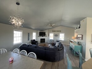 Relax in the living area with a sofa, dining table, and kitchenette.