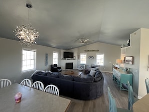 Relax in the living area with a sofa, dining table, and kitchenette.