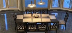 Enjoy meals in this stylish dining area with a large table and eight comfortable chairs.