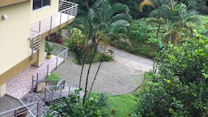 Enjoy a peaceful view from the balcony overlooking the beautifully maintained garden.