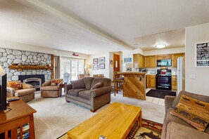 TV, fireplace, books