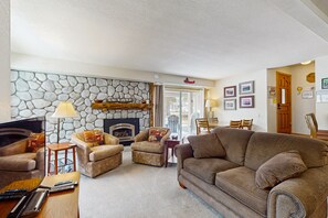 TV, fireplace, books