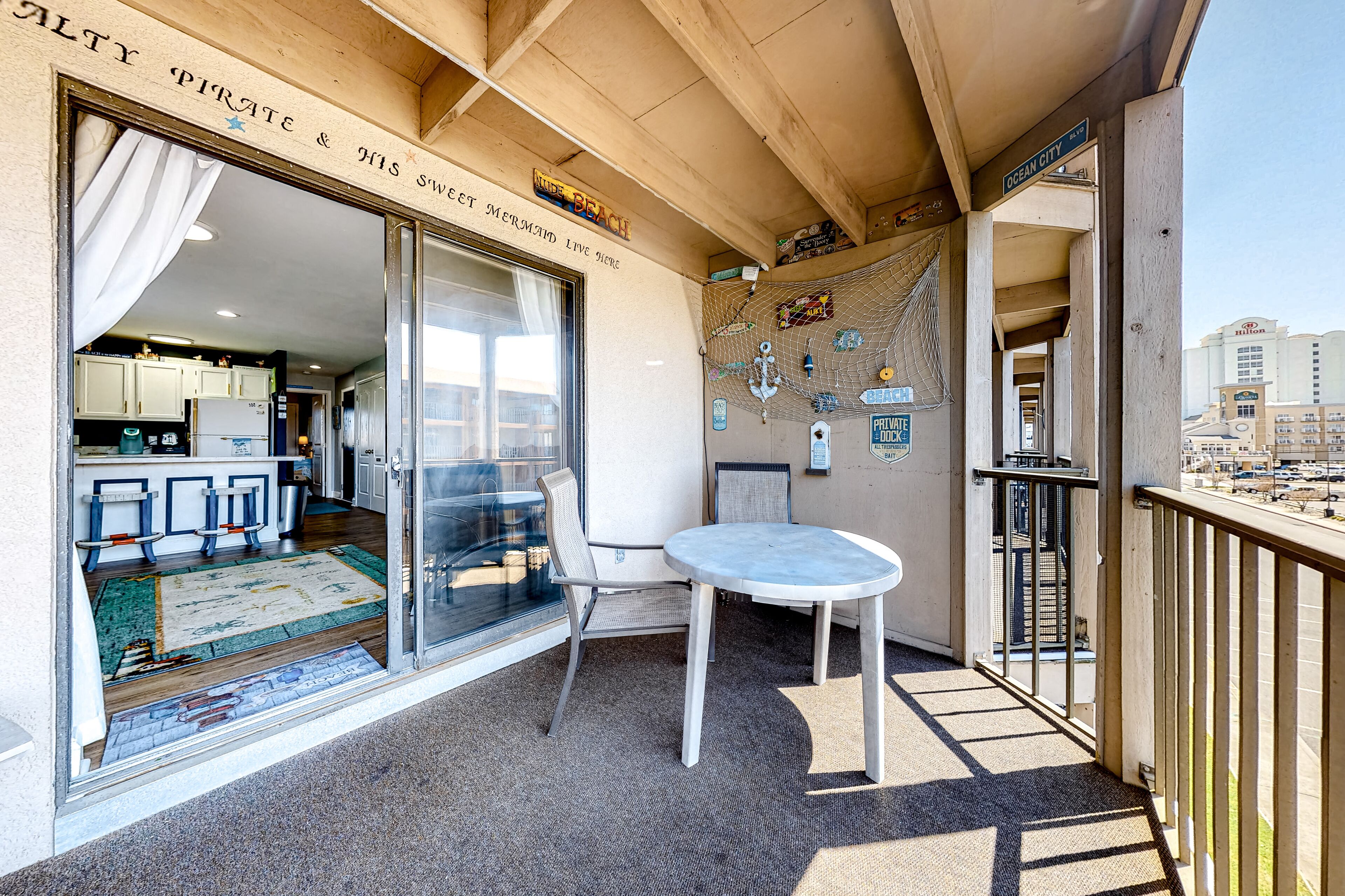 Updated third-floor condo with balcony, outdoor pool, & AC - walk everywhere