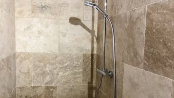 Shower, hair dryer, towels, toilet paper