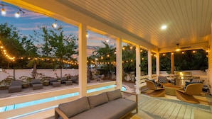 A covered outdoor area with a pool, seating, and string lights. - PRIVATE  POOL! 6 SEAT GOLF CART!  VOLLEYBALL COURT! 2 MIN. WALK TO BEACH! (Santa Rosa Beach)