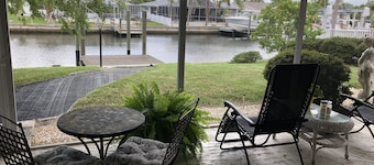 Lovely House on the canal with private dock, large fenced yard & pet friendly