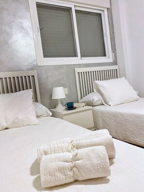 2 dormitorios, tabla de planchar con plancha, wifi gratis y ropa de cama