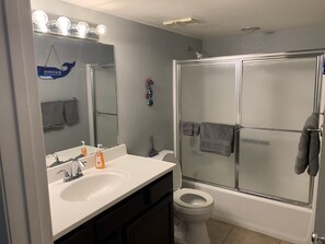 Combined shower/bathtub, hair dryer, towels, soap