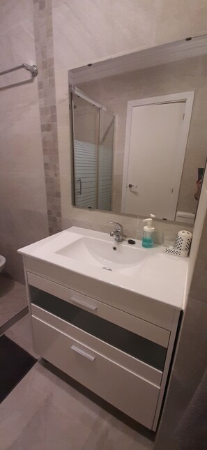 Shower, hair dryer, towels, soap