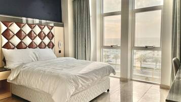 Desk, laptop workspace, bed sheets