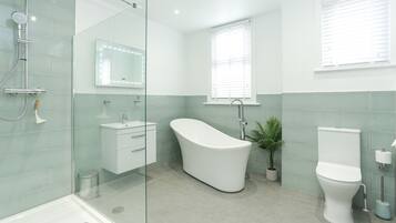 Bathtub, hair dryer, towels, soap
